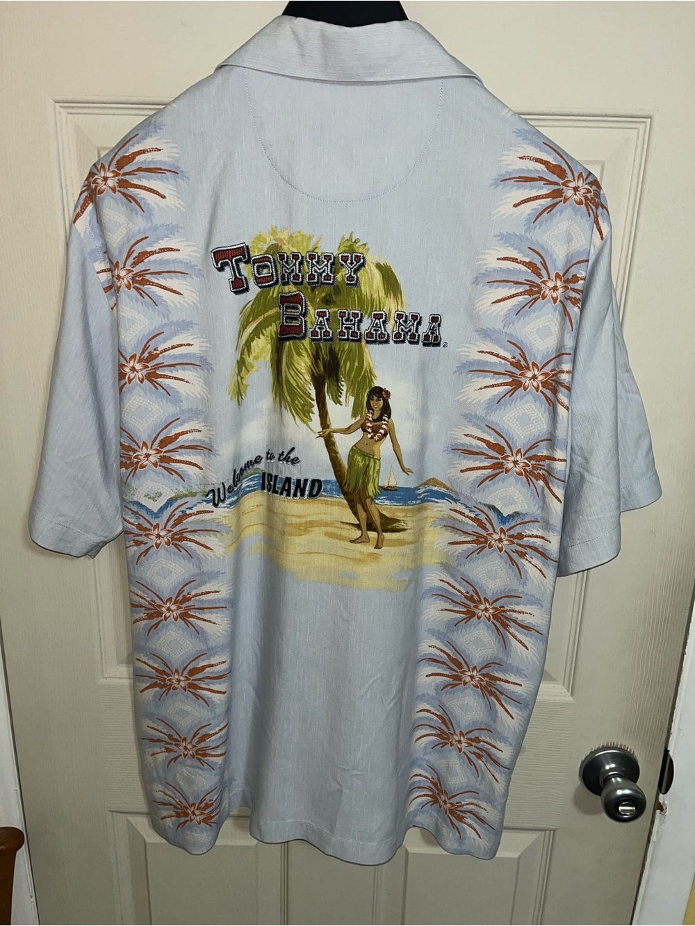 Men's size large Tommy Bahama camp shirt. "Welcome to the Islands" design.
